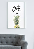 Pineapple poster with Olé typography in the living room via sofa