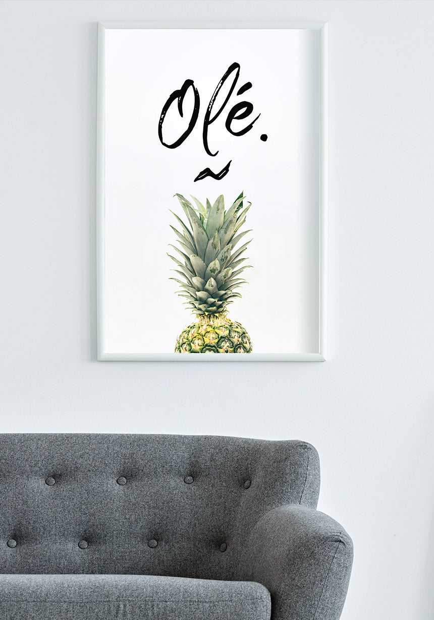 Pineapple poster with Olé typography in the living room via sofa