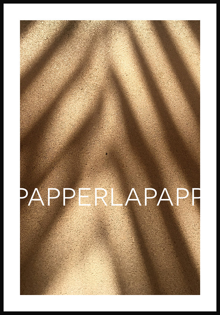 Poster on sand with shadow