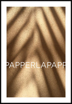 Poster on sand with shadow