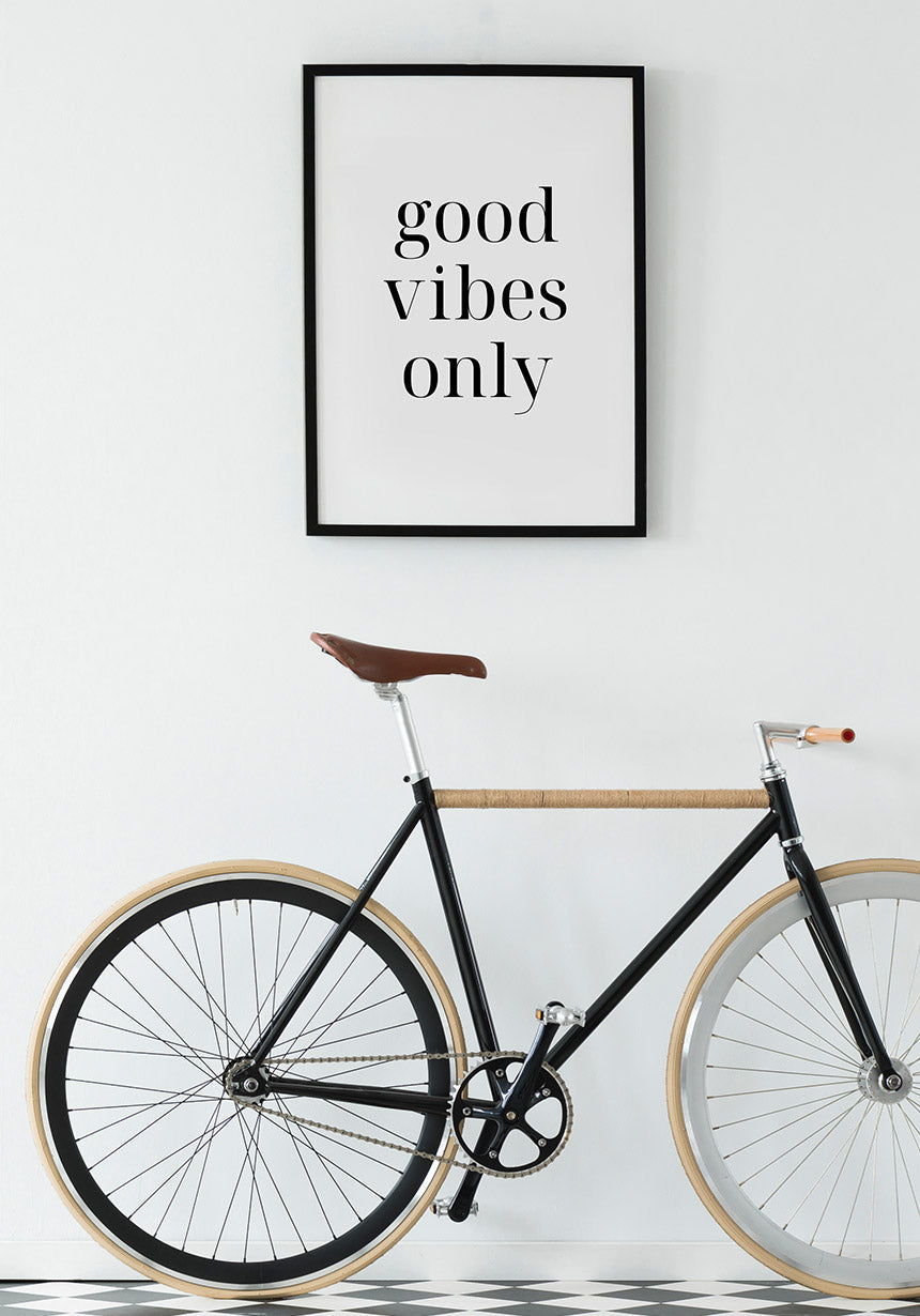 black-white good vibes only poster on bicycle