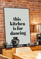 poster this kitchen is for dancing in front of brick wall
