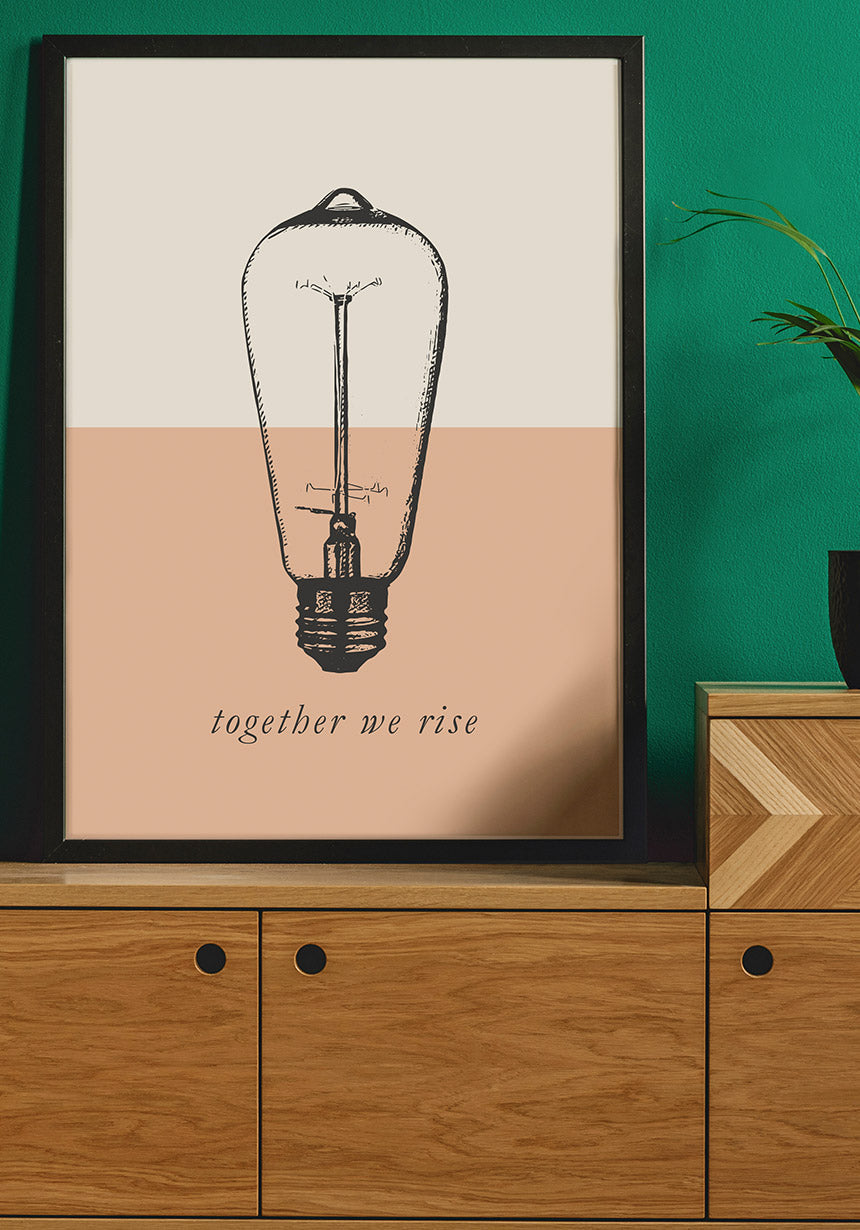 Vintage poster light bulb together we rise on sideboard